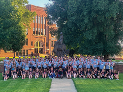 Junior counselors from the Northwestern Scholar Ambassadors and Camp Ranger 2023 attendees pose for a photo with Rowdy the Ranger in front of the Ranger Statue near Jesse Dunn. Incoming Northwestern freshmen can register for Camp Ranger 2024 until July 31. 