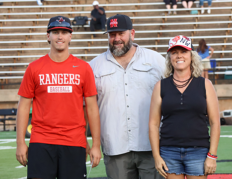 Alva freshman health and sports science education major Bo Stewart (left) accepts his $500 tuition prize with his parents, Chris Stewart (center) and Tisha Stewart (right).