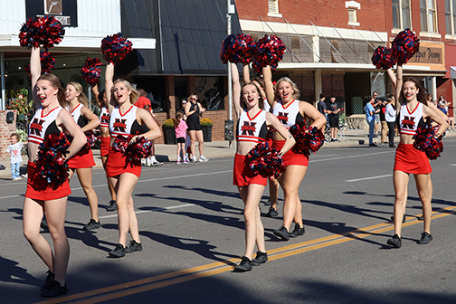 The Ranger Cheer squad is all smiles at the Homecoming parade on Alva’s downtown square Saturday.