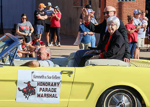 2024 Parade Marshals Kenneth and Sue Fellers (right) lead the Homecoming Parade on Saturday, Oct. 5.