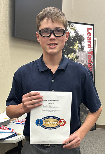 image of Finley Harrel with his certificate