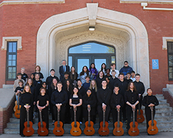 Participants in the 2024 Guitar Festival pose outside Ryerson Hall with Max Ridgway, Northwestern Oklahoma State University adjunct instructor of music. 