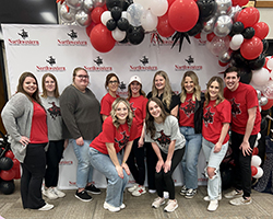 A group of volunteers from the Northwestern Department of Social Work at the 11th annual Primp for Prom event at Woodward High School. Back row, from left to right: Krystan Pierce, Isabella Burden, Harlie Altland, Northwestern Department of Social Work professor Codi Harding, social work department chair Dr. Kylene Rehder, McKenzie Cramer, social work adjunct instructor and Northwestern Alumna Jennifer Pribble, Kinley Rehder and Northwestern social work alumna Jonathan Wales. Front row, from left to right: Summer Verrill and Blakely Rehder.