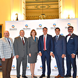 University leaders, including Northwestern President Bo Hannaford, gather to sign the nursing articulation agreement with Gov. Stitt.