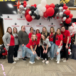 A group of volunteers from the Northwestern Department of Social Work at the 11th annual Primp for Prom event at Woodward High School. 