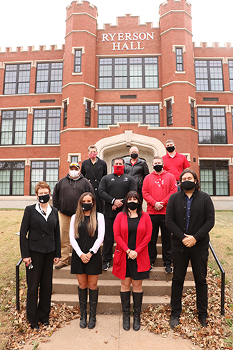 Dr. Janet Cunningham, university president (front row, far left), joins Northwestern’s five-year service award recipients (from left to right, back row) Dr. Christee Jenlink, Dr. Kaylene Armstrong, Evan Vaverka, (middle row) Chuck Korff, Matt Walter, Cory Sullivan (front row) Olivia Yandel, Sadie Bier and Kyle Larson. Not pictured are Dawn Allen, Dr. Mariann Braten-Hall, Dr. Josh Hawkins, Dr. Karsten Longhurst, Bruce Stoll, Jean Wahlgren and Keith Wear.