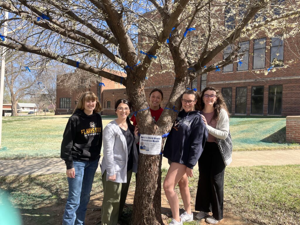 Pictured are (left to right) Bailey Pelland, junior SWAT member; Elizabeth Dennett, senior SWAT member; Brianna Wisby, senior SWAT member; Bishop Buck, junior SWAT member; and Kori Salinas, senior SWAT member, with the blue ribbon tree at the Northwestern-Alva campus.
