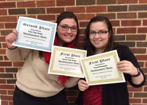 Northwestern News editors Ashley Strehl (left) and Michelle Willson show off some of the awards the newspaper’s staff won April 6 at the Oklahoma Collegiate Media Association spring conference at Oklahoma State University in Stillwater.
