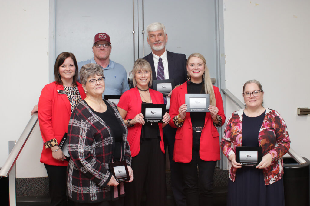 Northwestern’s 10-year service award recipients are (from left to right, back row) Stockton Graves, Dr. James Bell (middle row) Dr. Jennifer Oswald, Lisa Cline, Paige Fischer (front row) Dr. Shelly Wells and Shannon Leaper. Not pictured are Tim Lauderdale and Trent Spade.