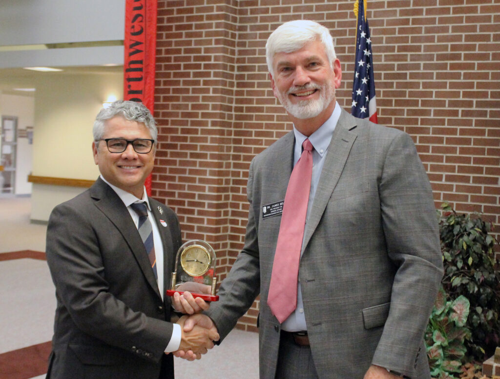 (Left) Dr. Wayne McMillin, Northwestern’s Enid campus dean, receives his 25-year service award from Dr. James Bell, vice president for academic affairs.