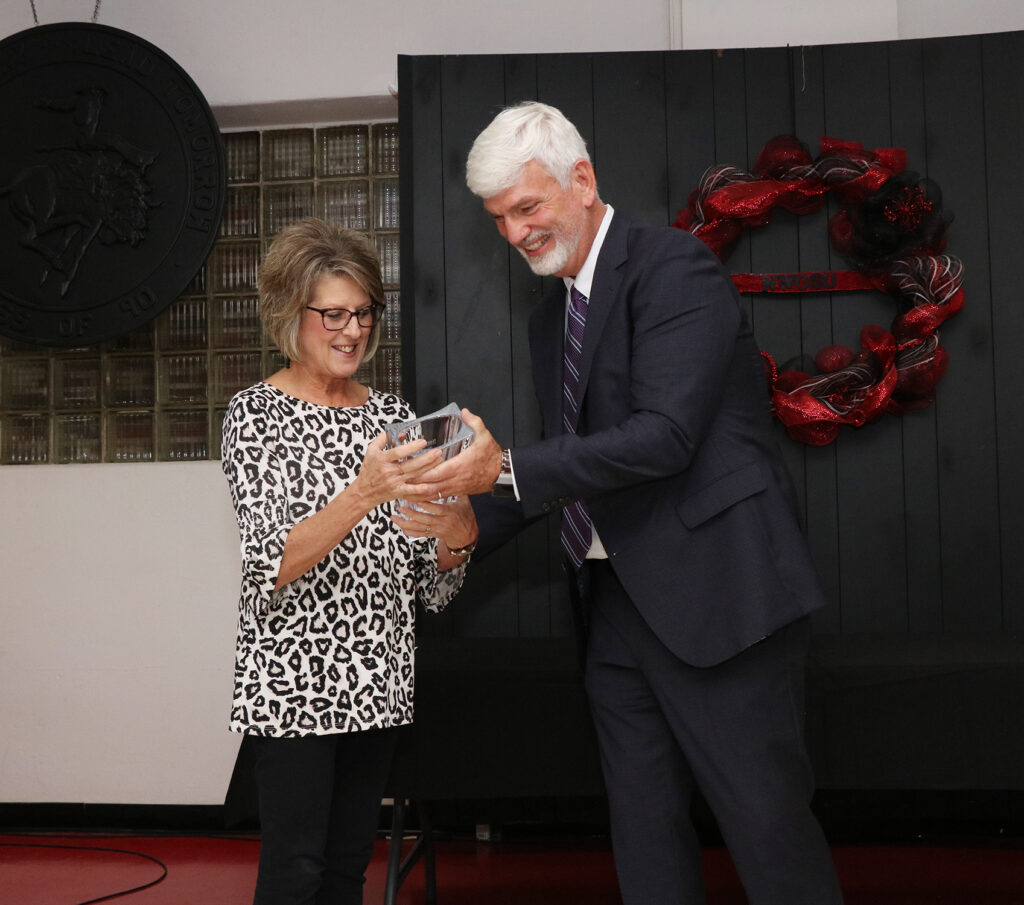 (Left) Diane Penner, UDS/Records Coordinator, receives her 35-year service award from Dr. James Bell, vice president for academic affairs.