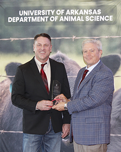 Dr. Dean Scarbrough recieves the "Advanced Graduate of Distincton Award" from the University of Arkansas Animal Science Department on April 21.