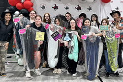 Student shoppers from Shattuck High School pose with the dresses they chose at the 12th annual Primp for Prom event in Woodward. Each student shopper registered to receive a scholarship to attend Northwestern Oklahoma State University after graduation.